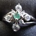Sterling Silver Ring with Green Stone and 8 CZs