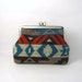metal frame cosmetic pouch- tribal geometric soft knit