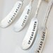 Vintage hand stamped cheese or jam spreaders spread love joy peace cheer recycled silver plated flatware silverware