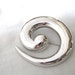 Monet silver tone pin with swirl design
