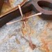 Forged Copper Cross on Brown Suede