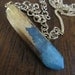 La Ultima Necklace- SM 24 carat, electro plated, quartz crystal(Blue) on gold fill