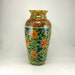 Tall blue handmade porcelain vase with orange flowers