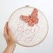 Butterfly Embroidery Hoop - Joy Flutters In - hand embroidered 10" wall hanging in peach, coral pink, beige, white, and lilac