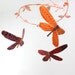 3 dragonflies dream of spring - fabric mobile in peach, orange, crimson red, pink, and purple