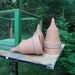 Unusual terra cotta pot with a point