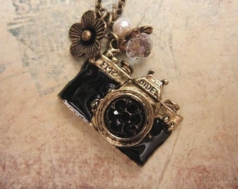 Take a picture. a vintage camera necklace adorned with pearl and crystal bead