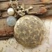 Breeze. a locket necklace with blue agate stone, pearl and bird charm accent