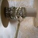8" of antique rhinestones in vertical rectangles
