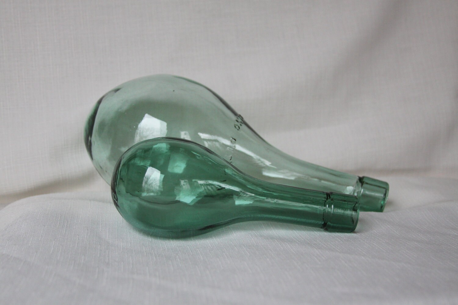 On reserve Two Unique Round Bottom Vino Wine Bottle Green