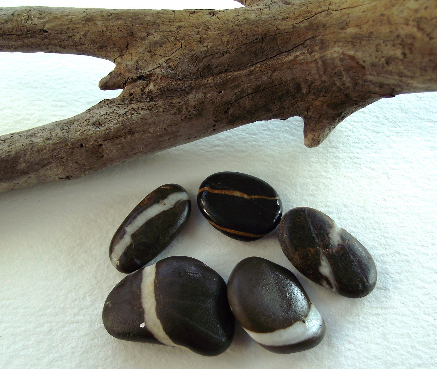 Black rocks. Smooth striped stones.5 Black pebbles by oceangifts