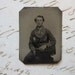 tiny antique gem TINTYPE photo - man in uniform, sitter, seated - GTD16a