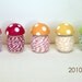 Wee Toadstool Spools Set. With stripey twine. New edition. Full set. Seven colors.