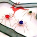Three Small Hanging Spiders Red, Blue and Green