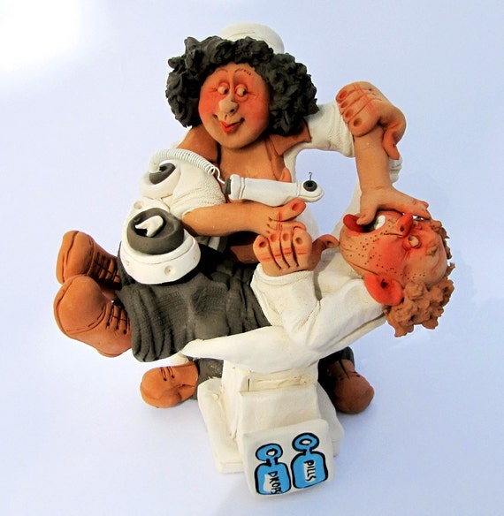 Female Dentist with a Drill and Her Patient