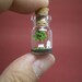 Tiny green tree and a couple in a tiny bottle ver.2