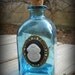 Blue Glass Bottle with Divers Helmet