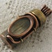 Waterproof pill bottle pendant. relic holder. Screw on cap. Brass, copper and glass. Reliquary