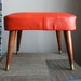Retro Orange Vinyl and Wood Legs Ottoman - Footstool - Eames Era Mid Century