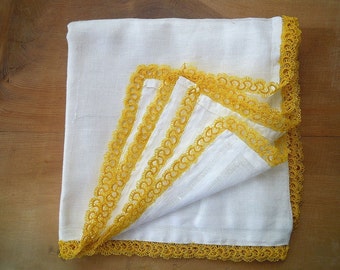 white scarf, yellow tatted edging
