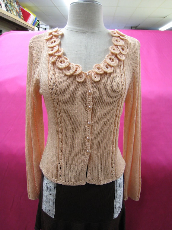Peach color cardigan with buttons up front plus crochet floral