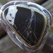 Large white buffalo ribbon turquoise set into handmade sterling silver ring setting