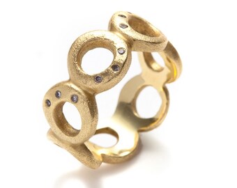 seven circles 18K green gold ring with diamonds