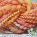 RESERVED for Sandy Handspun homegrown wool art yarn 50 yards extra bulky Peach Sorbet sparkling orange metallic wrap