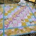 Spring Sunshine quilted table centerpiece in bright spring colors of yellow, orchid and robins egg blue