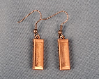 A darling pair of antique copper harmonica charm earrings