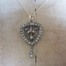 Edwardian Pendant. Rhinestones and Goldtone. Shield Shape.