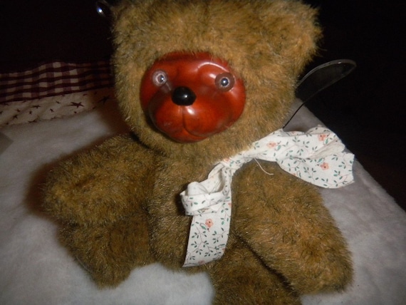 teddy bear with wooden face