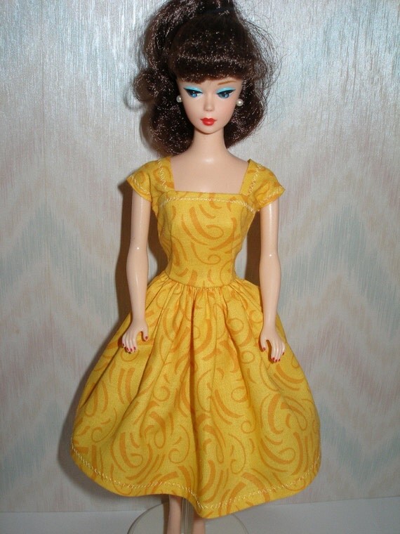 barbie doll in yellow dress