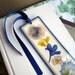 Pressed Flower Blue and Yellow Flowers Collage Style Laminated Bookmark
