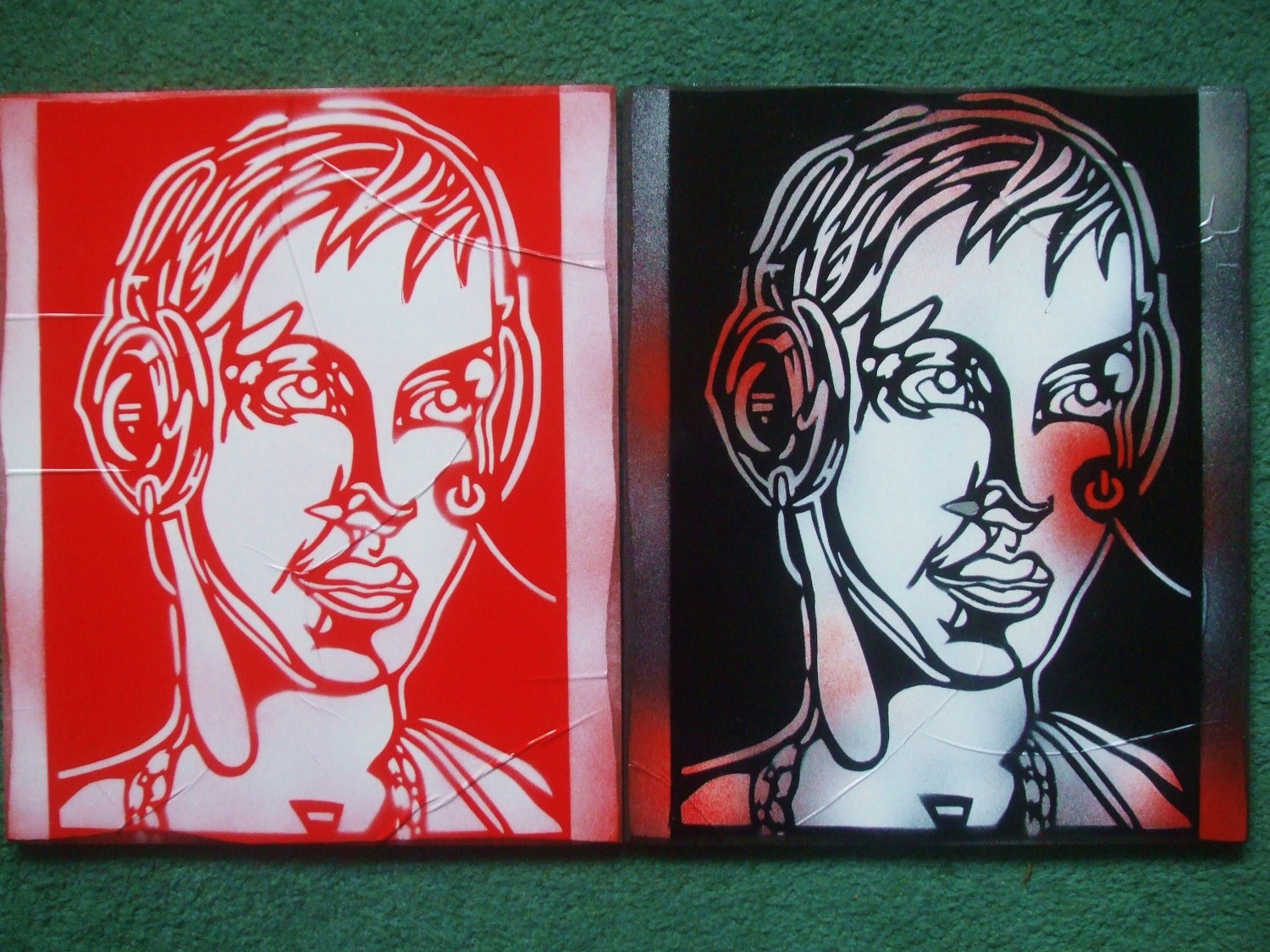 DJ with headphones painting stencil art spray paint canvas red