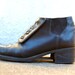 Vintage Black Leather NAOT Chelsea Ankle Boots with Brass Eyelet Buckles and Elastic Ankle