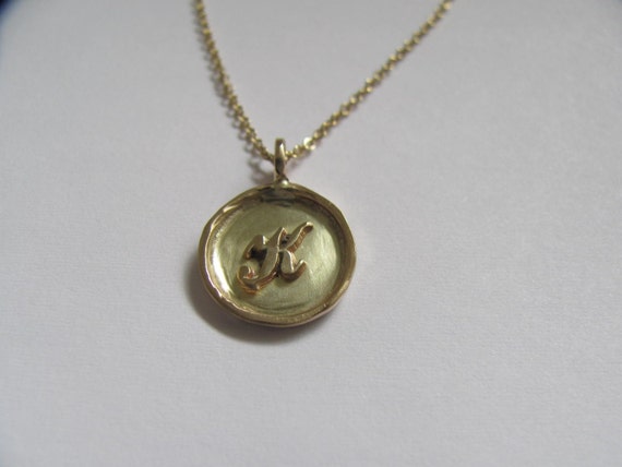 14k gold framed disc necklace with 14k gold raised by christienano