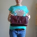 1970s OXBLOOD red leather clutch