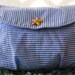 Blue and white striped seersucker clutch