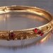 Vintage Bracelet Bangle Goldtone Red Rhinestones Mid Eastern Moroccan Style Ornate Engraved