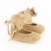Golden baby booties from lace covered suede leather