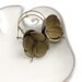 Modern style leather earrings in moss green