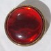 Vintage red button with a moonglow shine to it