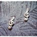 Tiny Treble Clef Post Earrings in Sterling Silver