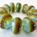 12 Handmade Glass Beads in Matte Translucent Sea Glass Blue, Frit, Multi Colors and Fine Silver by SRA Sarah Klopping