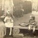RESERVED FOR TOPKATGENERATION Toddler Holds Banjo While Her Mother Braids Her Sister's Hair Photo Postcard Circa 1910s