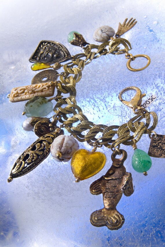 Items similar to Exotic Brass Charm Bracelet on Etsy