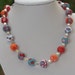 Summer beaded necklace in red, orange, turquoise and white, polymer clay, silver cubes and swaovski beads