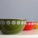 midcentury metal nesting enamel mixing bowls in avocado green, flame, & harvest gold
