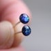 super tiny circle post earrings in sparkly deep blue galaxy